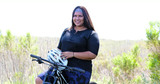 Image of a confident woman wearing women's plus-size cycling apparel.