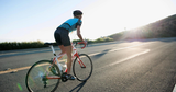 Image of a woman wearing stylish women's mountain biking apparel on a trail.